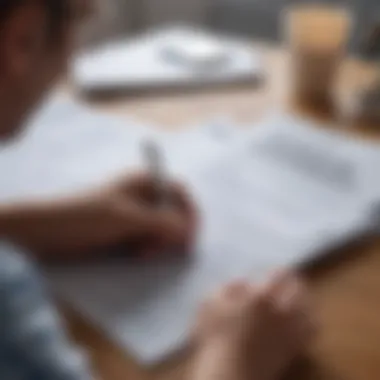 Reviewing Home Insurance Policies A close-up of a homeowner reviewing insurance documents