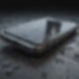 Close-up of an old smartphone with a cracked screen.