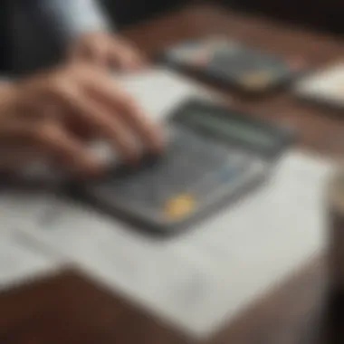 A person reviewing their financial documents with a calculator