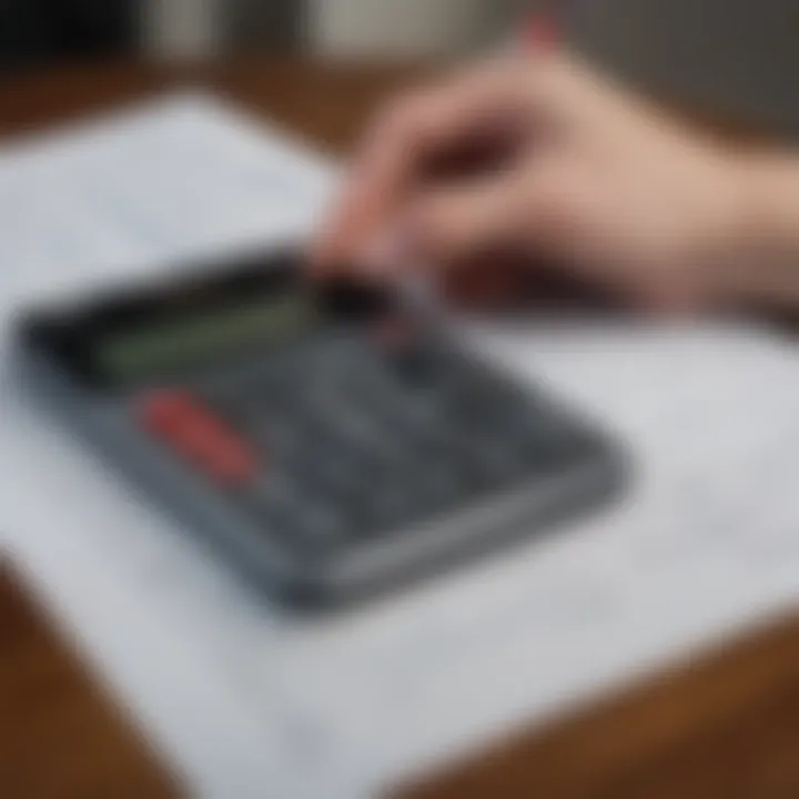 A person reviewing their financial goals with a calculator