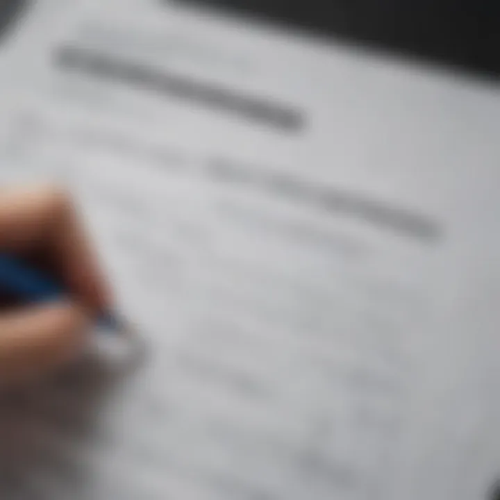 A close-up of a hand holding a pencil over a budgeting sheet, indicating careful financial planning.