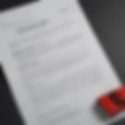 A close-up of a car insurance policy document with a cancellation notice