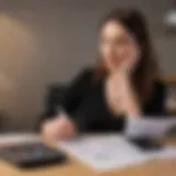 A woman reviewing financial documents with a calculator